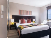 Quest Serviced Apartments Mascot